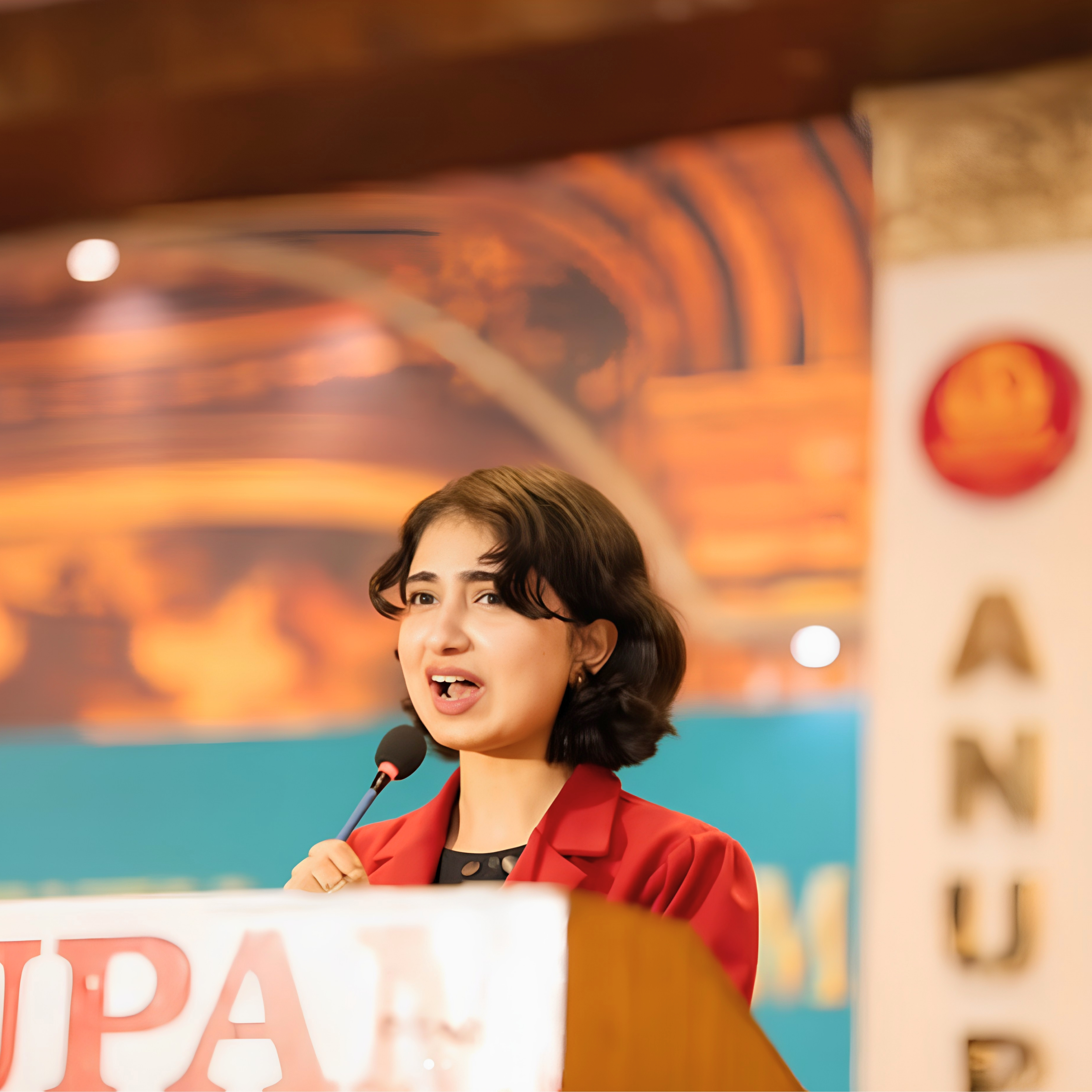 Anshika Gautam speaking at a literary event